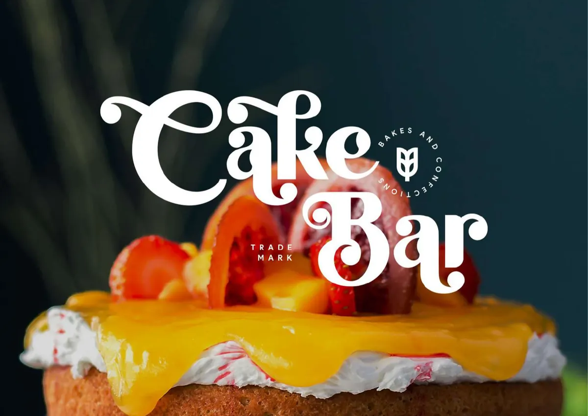 Cake Bar logo over a fruit cake