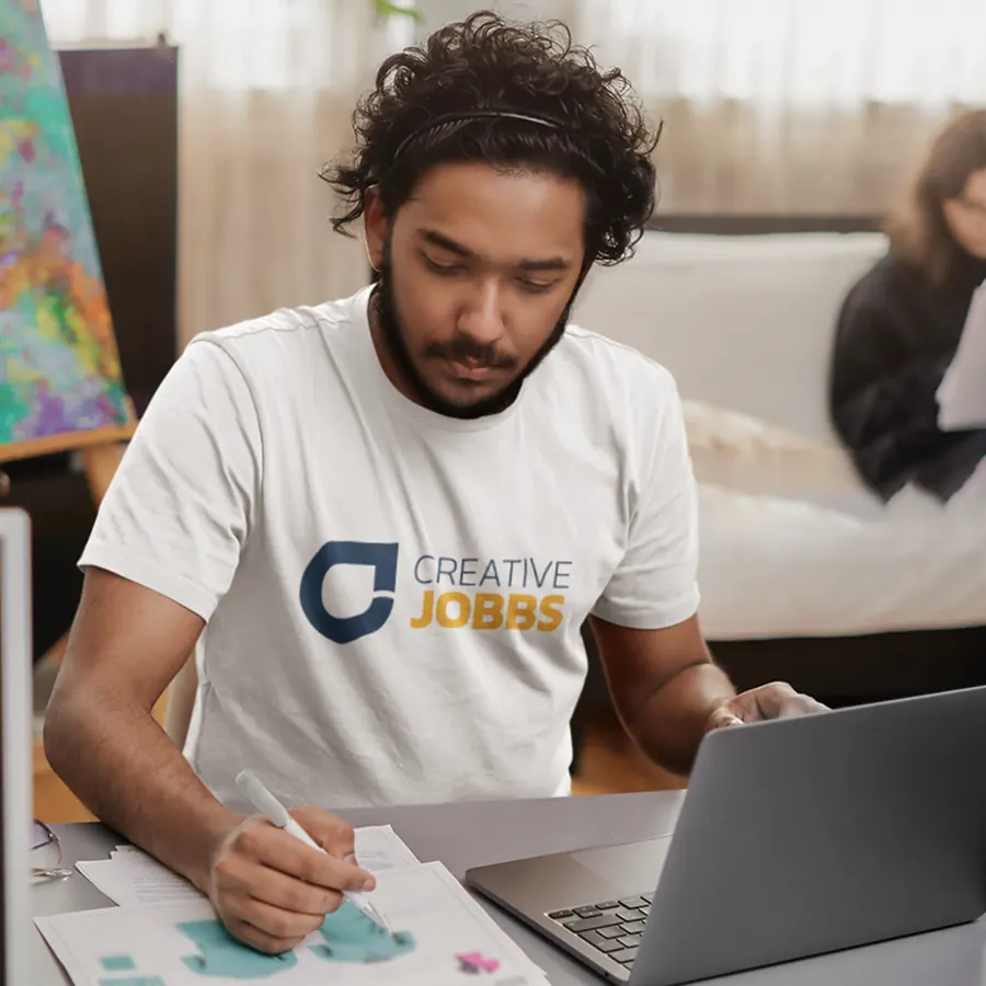 Designer at work wearing a Creative Jobbs t-shirt
